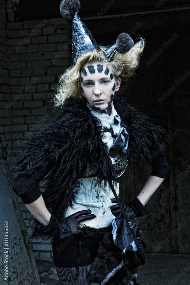 High fashion model with creative hairstyling and bright make up High fashion model with creative hairstyling and bright make up