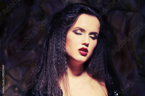Fototapeta Naklejka Na Ścianę i Meble -  young beautiful lady with magnificent dark hair