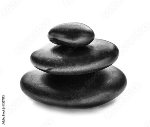 Stack of spa hot stones isolated on white