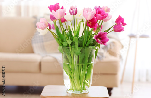 Bouquet of beautiful tulips in room interior