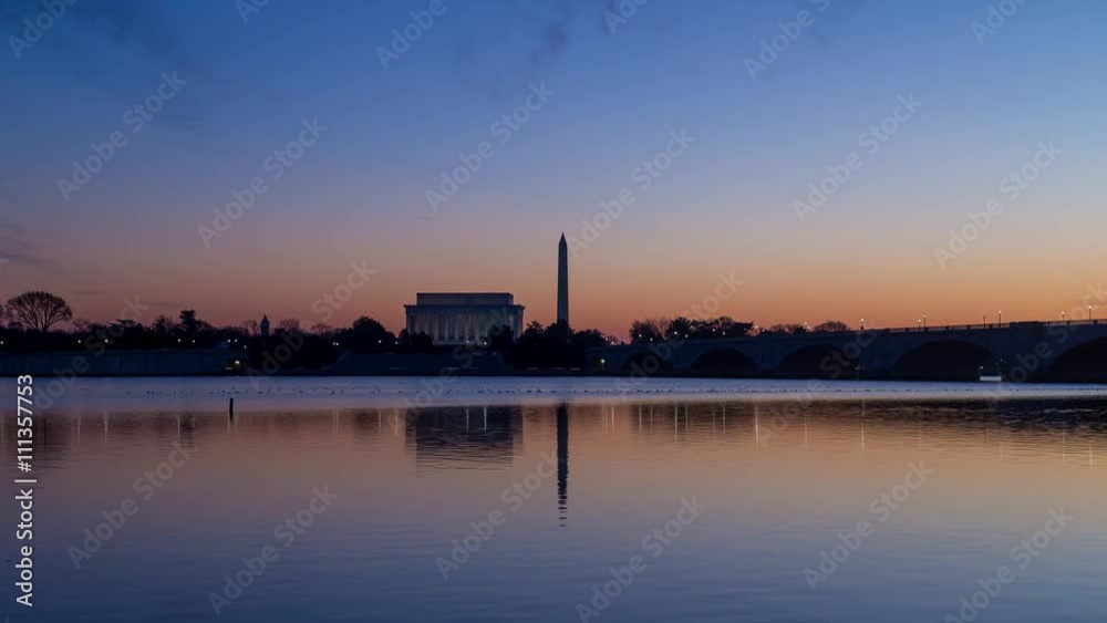 Time lapse of sunrise on Washington DC monuments. The Lincoln Memorial and Washington Monument can be seen across the Potomac River. Time lapse of sunrise on Washington DC monuments. The Lincoln Memorial and Washington Monument can be seen across the Potomac River.