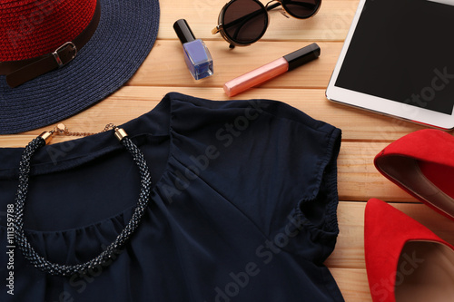 Composition of woman's fashion look on wooden background