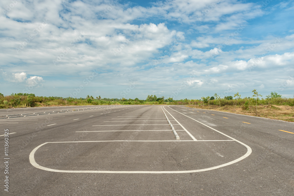 Empty parking lot against a beautiful blue sky