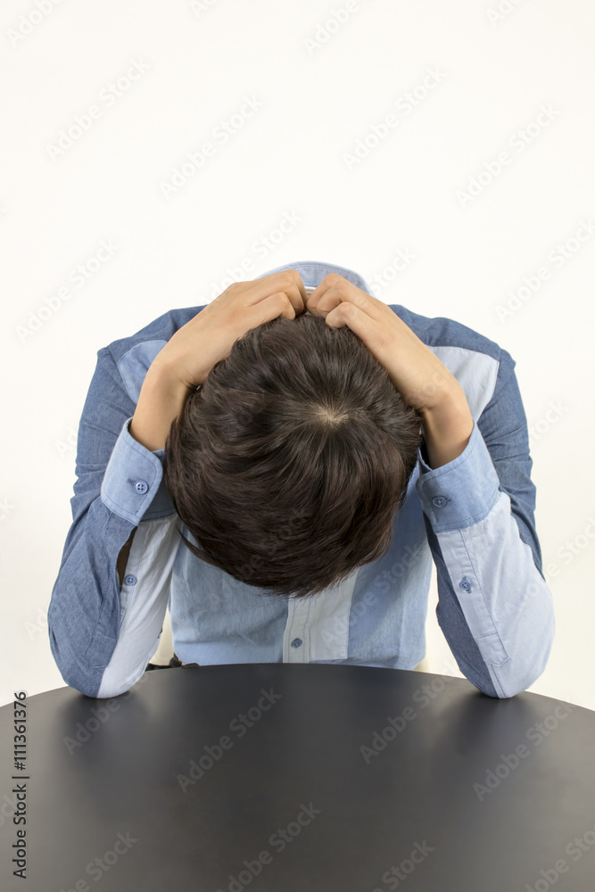 Depressed crying scared man holding his head in his hands Depressed crying scared man holding his head in his hands