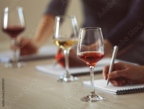 Experts tasting new sorts of wine at the table