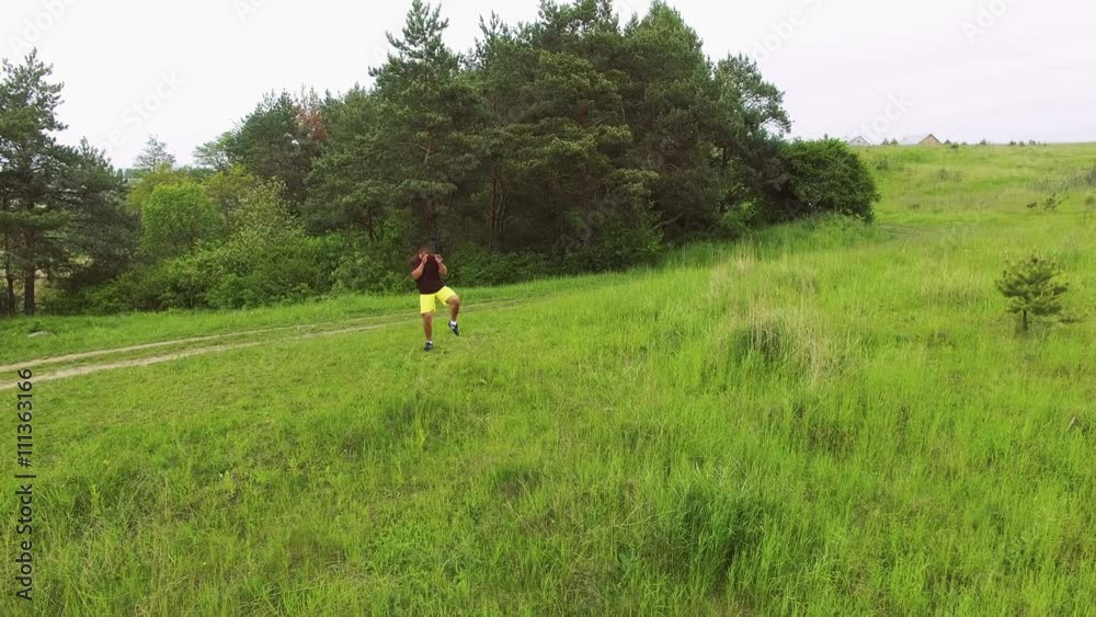 Aerial view of strong master doing exercise on the nature 4k Aerial view of strong master doing exercise on the nature 4k