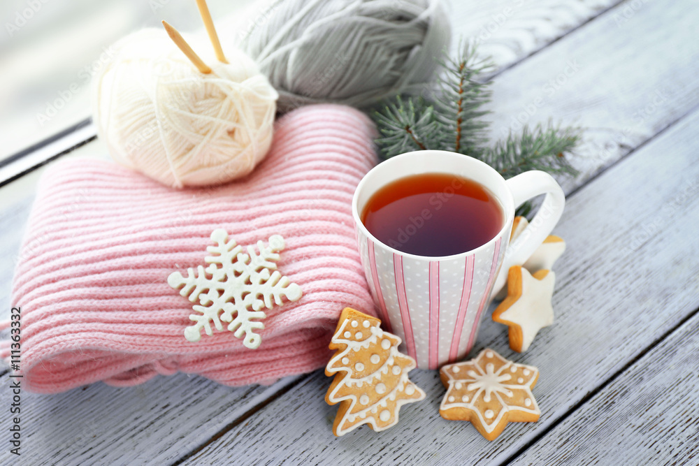 Beautiful winter composition with cup of hot drink, on wooden table