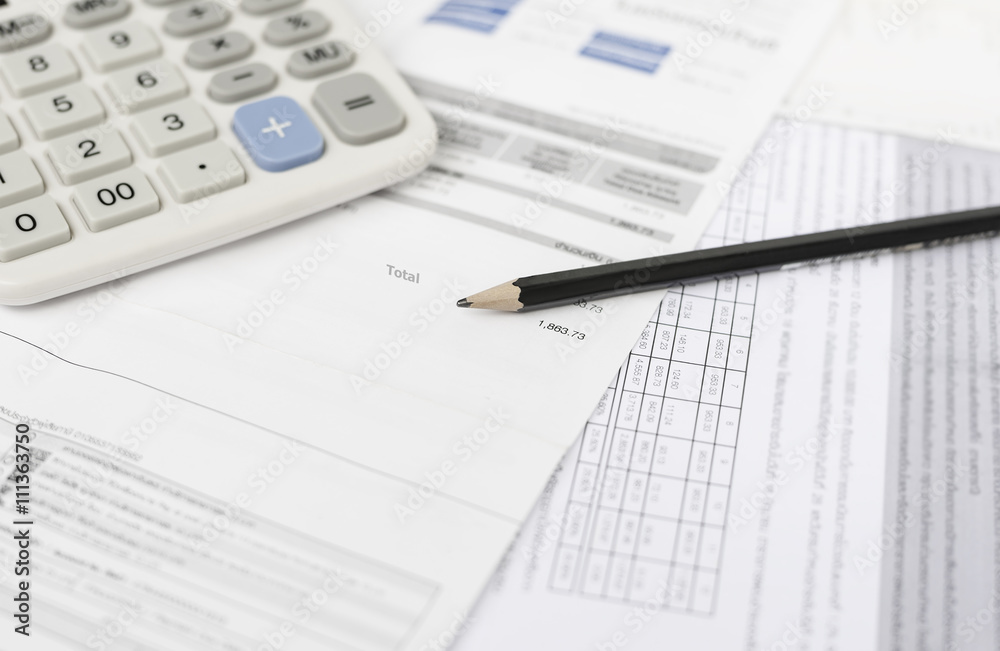Utility bill and calculator with pencil Utility bill and calculator with pencil