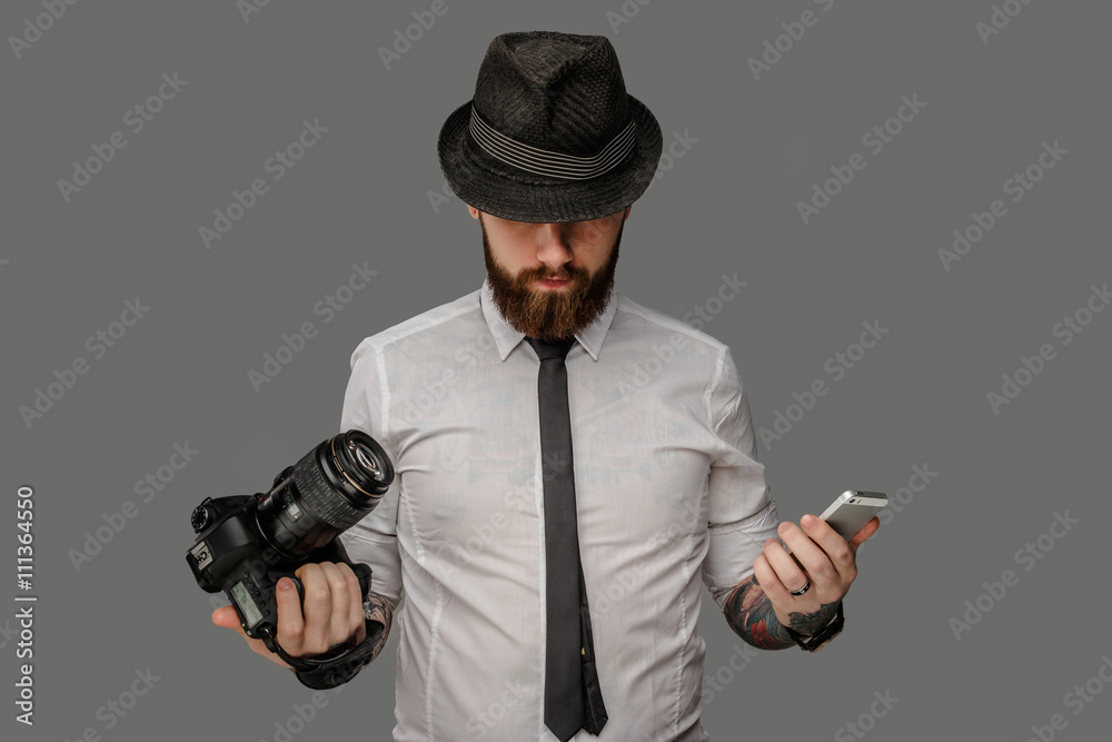 A man with dslr isolated on grey background. A man with dslr isolated on grey background.