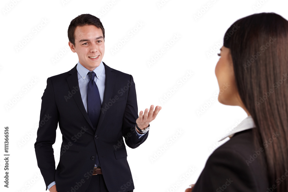 Young Caucasian business man smiling happily to a business woman Young Caucasian business man smiling happily to a business woman