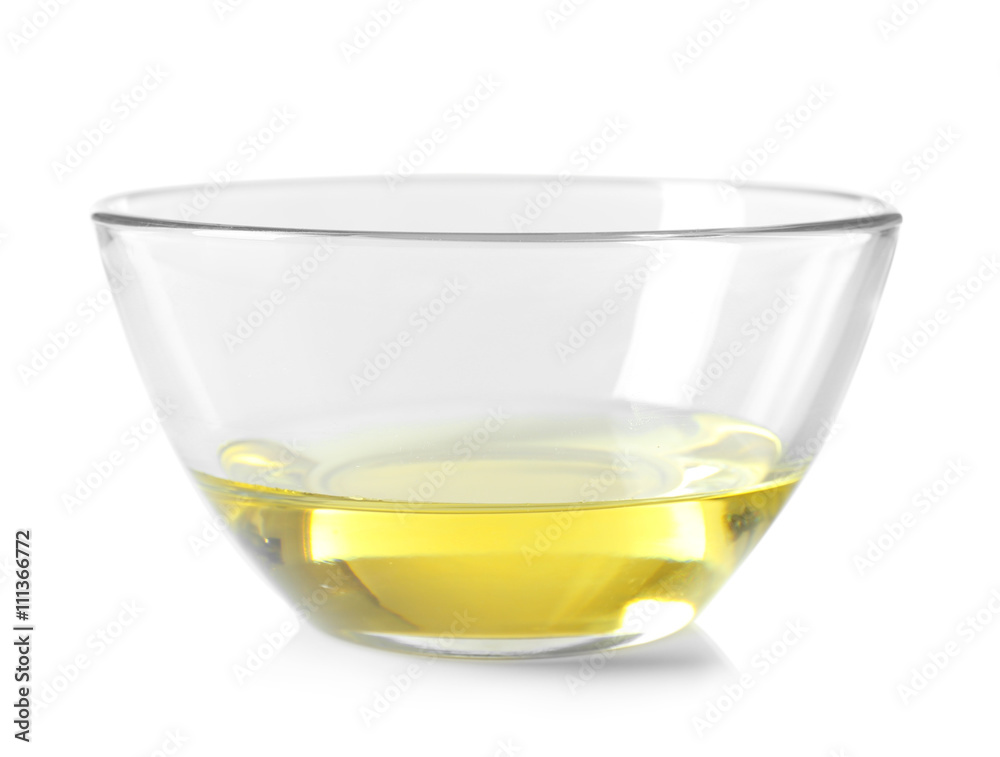 Avocado oil in a glass bowl isolated on white Avocado oil in a glass bowl isolated on white