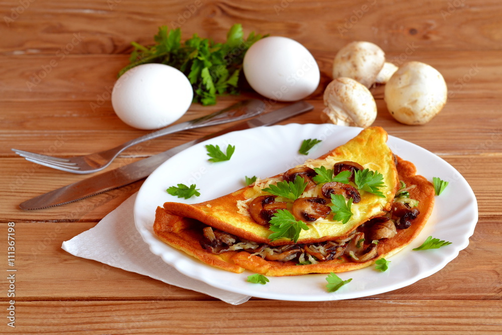Omelette made of eggs, milk, flour and salt. Scrambled eggs fried in butter. Omelette stuffed with fried mushrooms, cheese, parsley. Omelette made of eggs, milk, flour and salt. Scrambled eggs fried in butter. Omelette stuffed with fried mushrooms, cheese, parsley.
