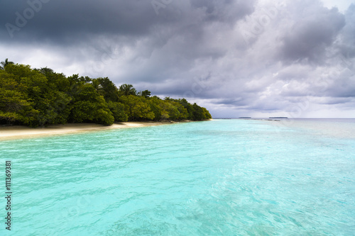 Beautiful island beach with sandspit at Maldives © czamfir