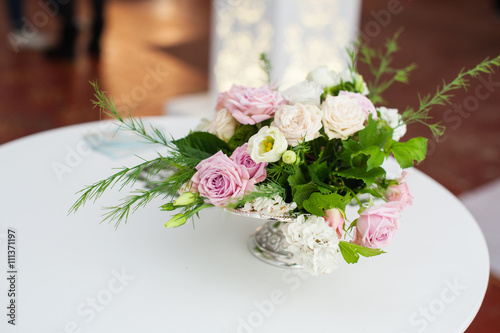 Fototapeta Naklejka Na Ścianę i Meble -  bouquet of flowers in vase at the wedding table