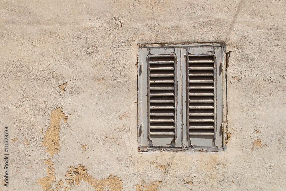 Old window with a shutter