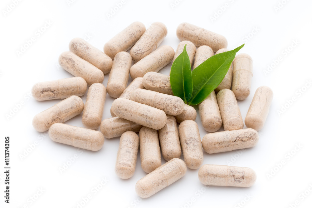 Ginkgo biloba capsule on the white background. Ginkgo biloba capsule on the white background.
