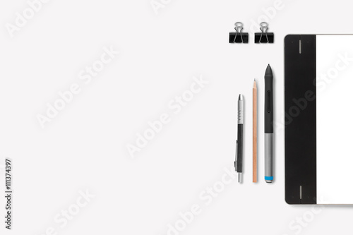 Graphic tablet with pencil on white background for text and back
