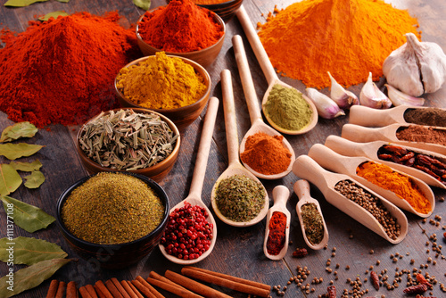 Fototapeta Naklejka Na Ścianę i Meble -  Variety of spices on kitchen table