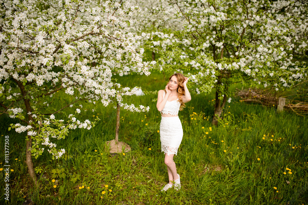 Beautiful woman in blooming garden Beautiful woman in blooming garden