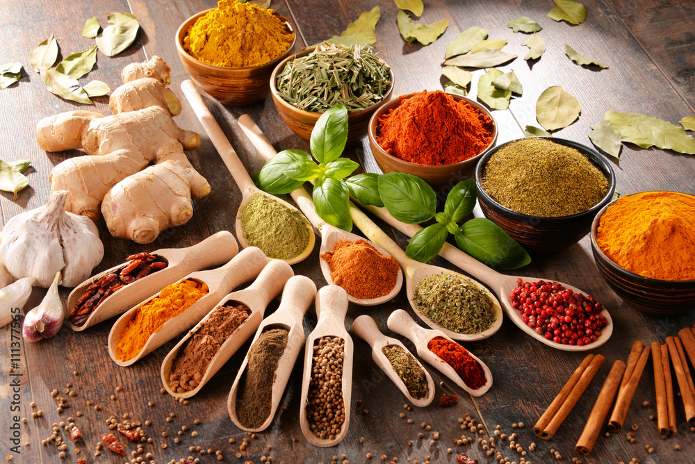 Fototapeta Variety of spices on kitchen table