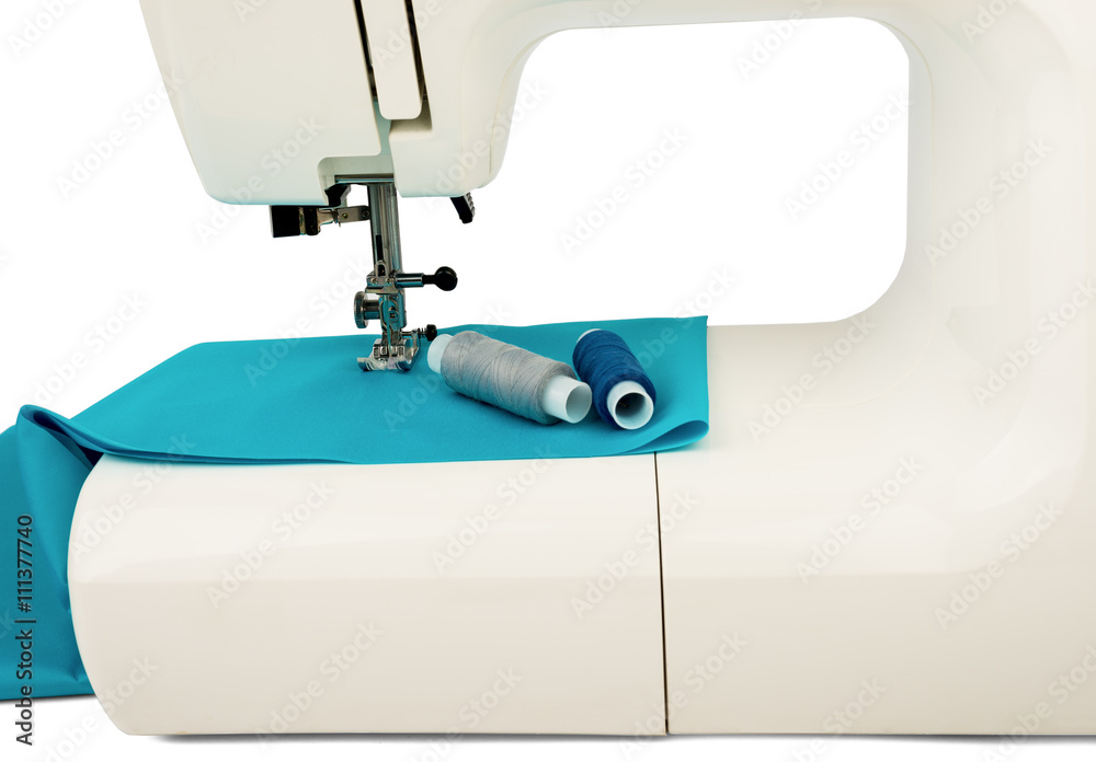 Machine sews with blue textile fabric