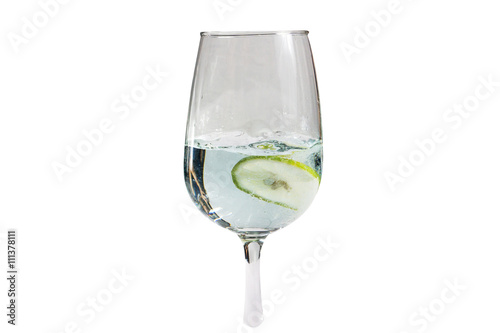glass of soda with lime on white background