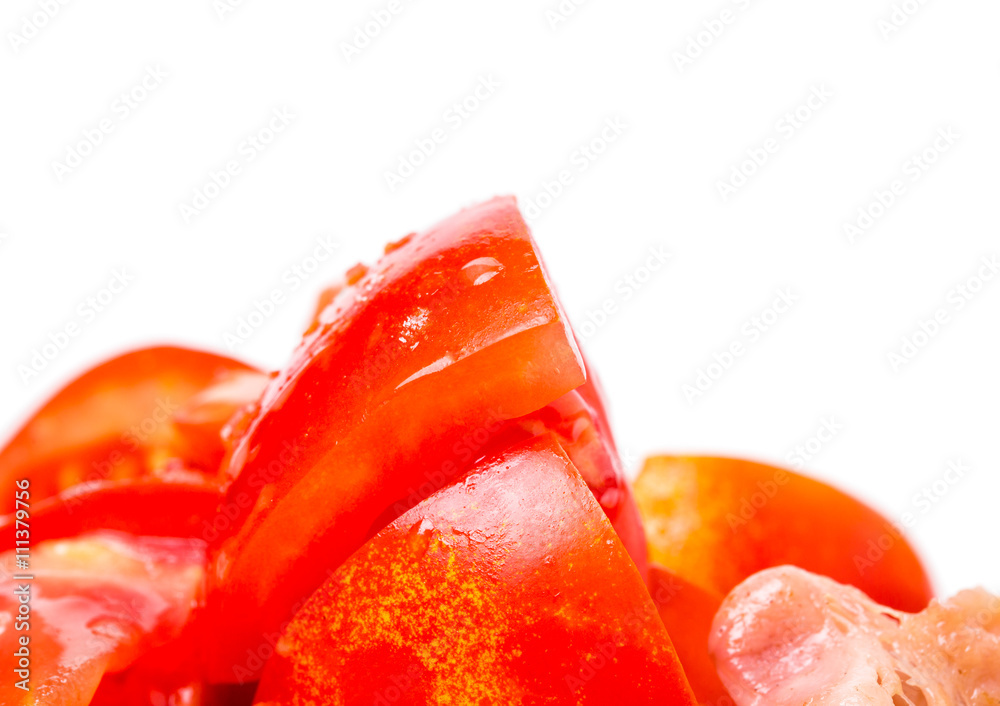Sliced tomatoes on top of fresh salad.