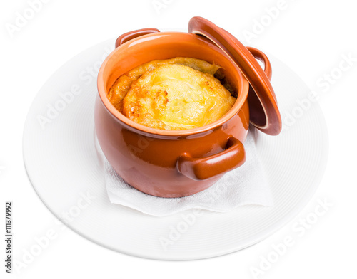 Obraz na plátně Pork sausages on crock pot with cheese.