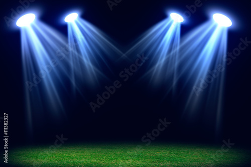 Grass field lit with bright spotlights © cherezoff