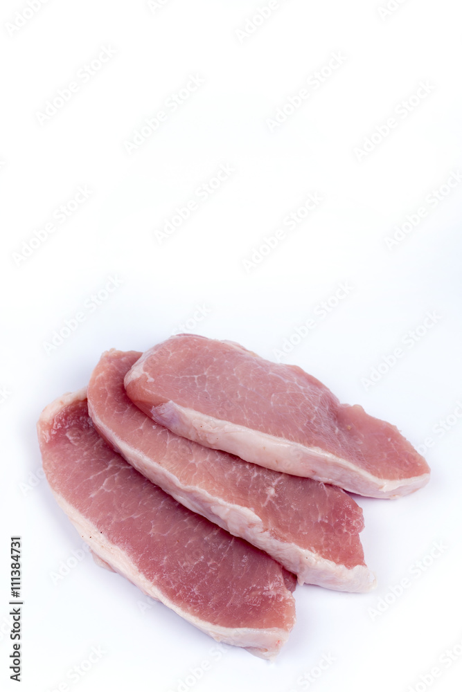 Three pork chops isolated over white background