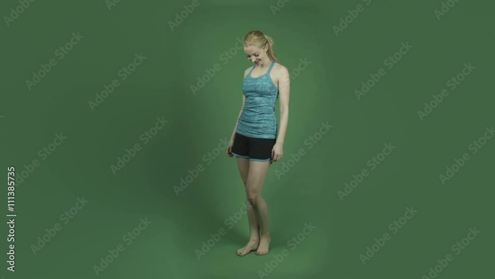 caucasian woman in sport outfit isolated on chroma green screen background strength confident