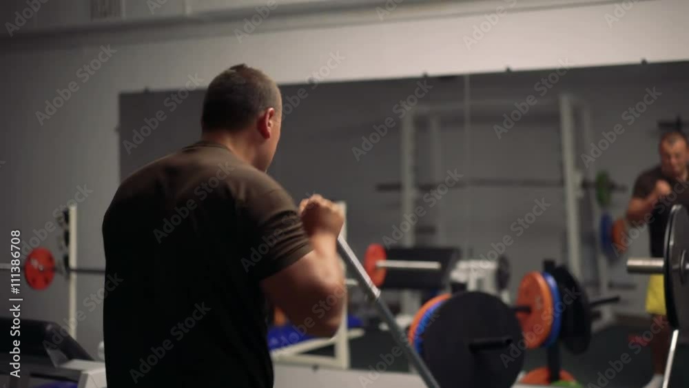 Man works with simulator in the gym 4k Man works with simulator in the gym 4k
