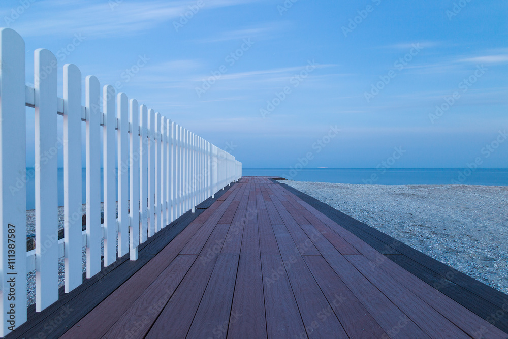Beautiful long exposure seascape with wooden pier 
