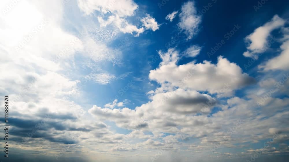 Beautiful summer day cloud timelapse. Clear crisp cloudscape with large, building clouds, light rays and sun flare, perfect for digital cinema composition background. Wide angle panorama lens Beautiful summer day cloud timelapse. Clear crisp cloudscape with large, building clouds, light rays and sun flare, perfect for digital cinema composition background. Wide angle panorama lens