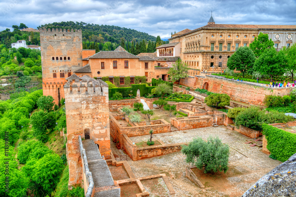 Wide aerial view over the famous Alhambra Palace and garden in Granada, Spain - obrazy, fototapety, plakaty 