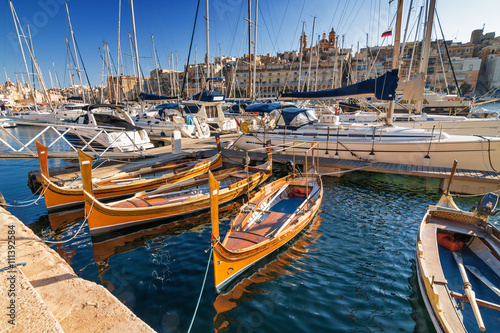 Traditional sailboats in the port of Valletta, Malta. photo