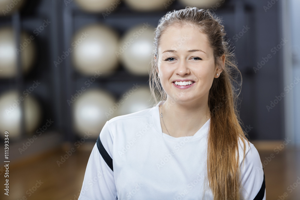Confident Young Woman Smiling In Gym