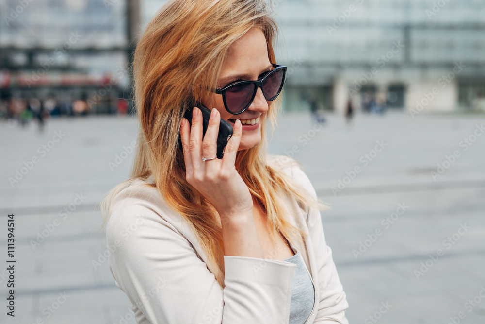 Girl talking on the phone. Urban background. Girl talking on the phone. Urban background.