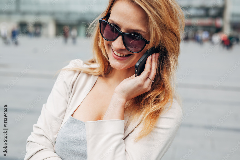 Girl talking on the phone. Urban background. Girl talking on the phone. Urban background.