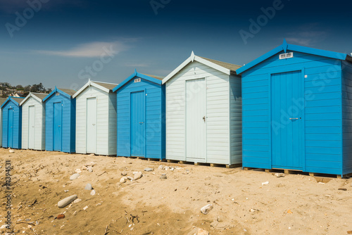 Blue beach huts in row © marcin jucha