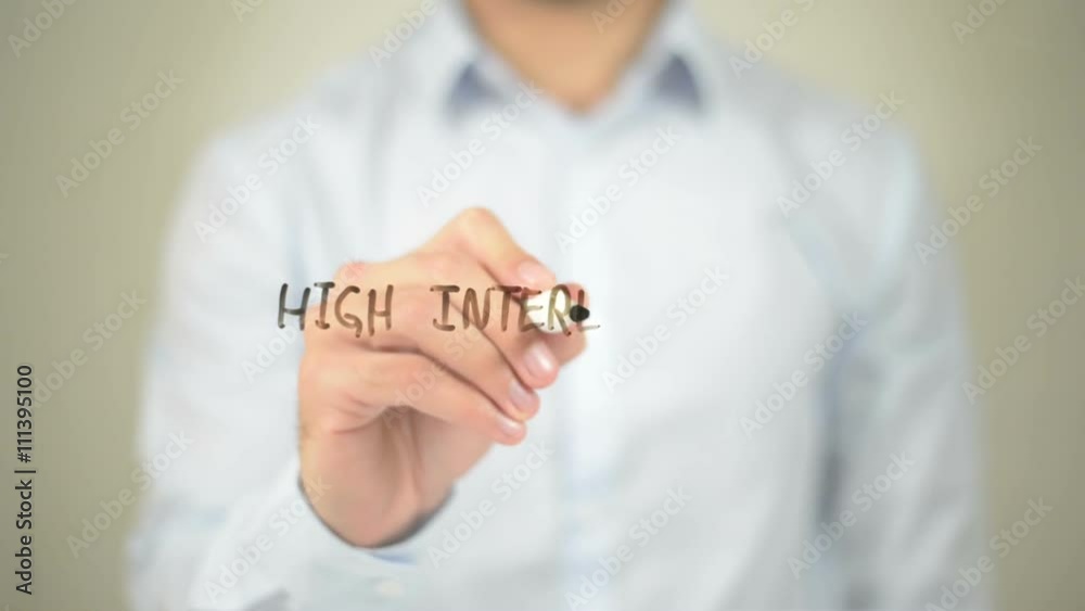 High Interest Rates, Man writing on transparent screen High Interest Rates, Man writing on transparent screen