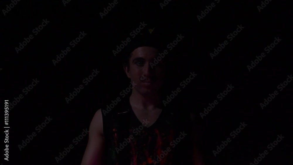 Juggler showing tricks with light balls in the whole dark.Close up.Slow motion Juggler showing tricks with light balls in the whole dark.Close up.Slow motion