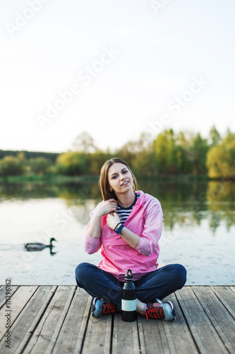 Hipster girl sits on pier © yuryrumovsky