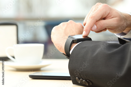 Businessman hands using a smart watch