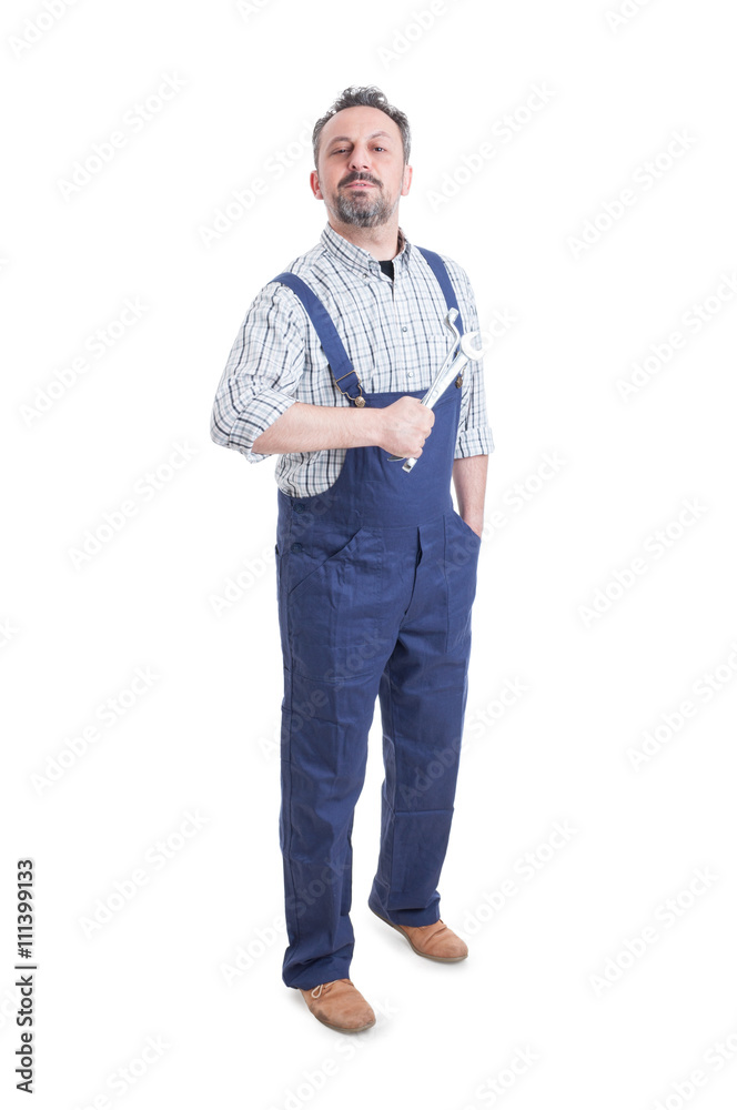 Handsome mechanic or repairman with spanner standing and posing Handsome mechanic or repairman with spanner standing and posing