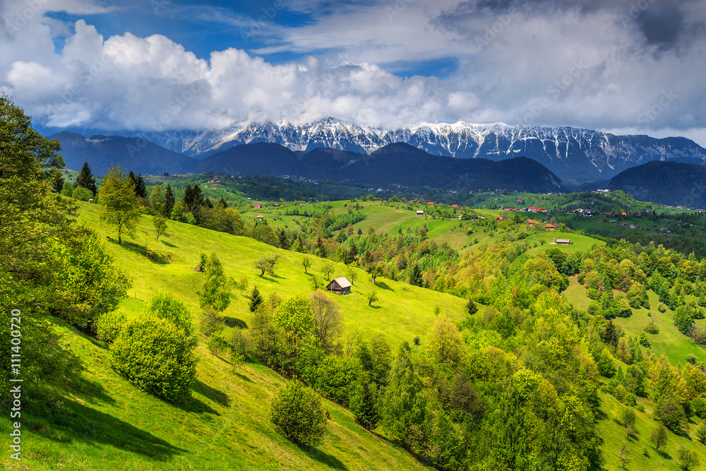 Summer landscape with snowy mountains near Brasov,Transylvania,Romania,Europe