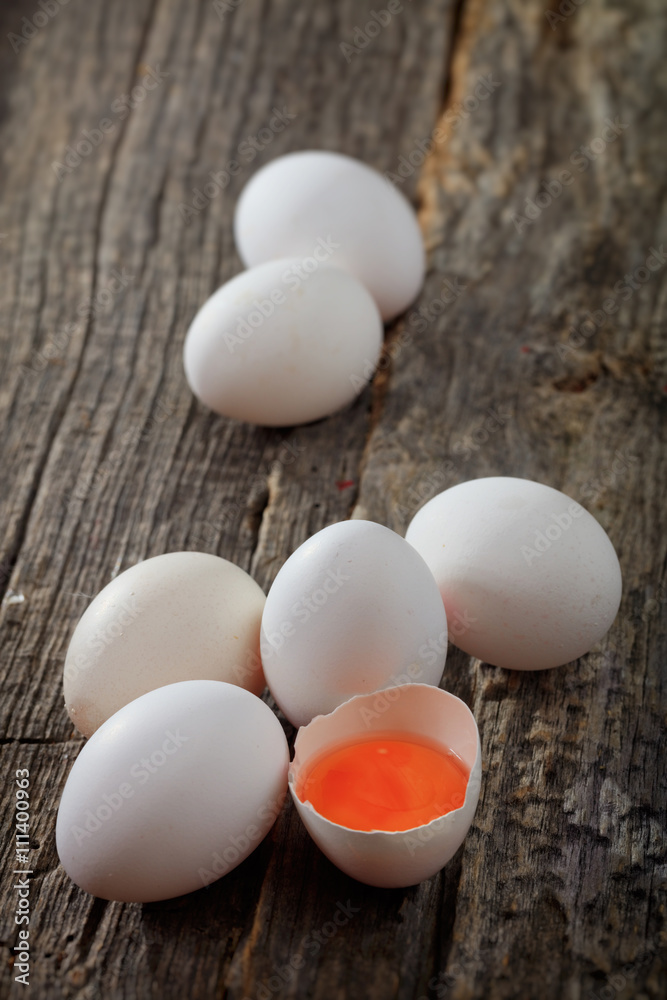 White chicken eggs, on wooden surface