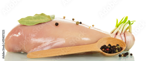 Raw chicken and spices isolated on white.