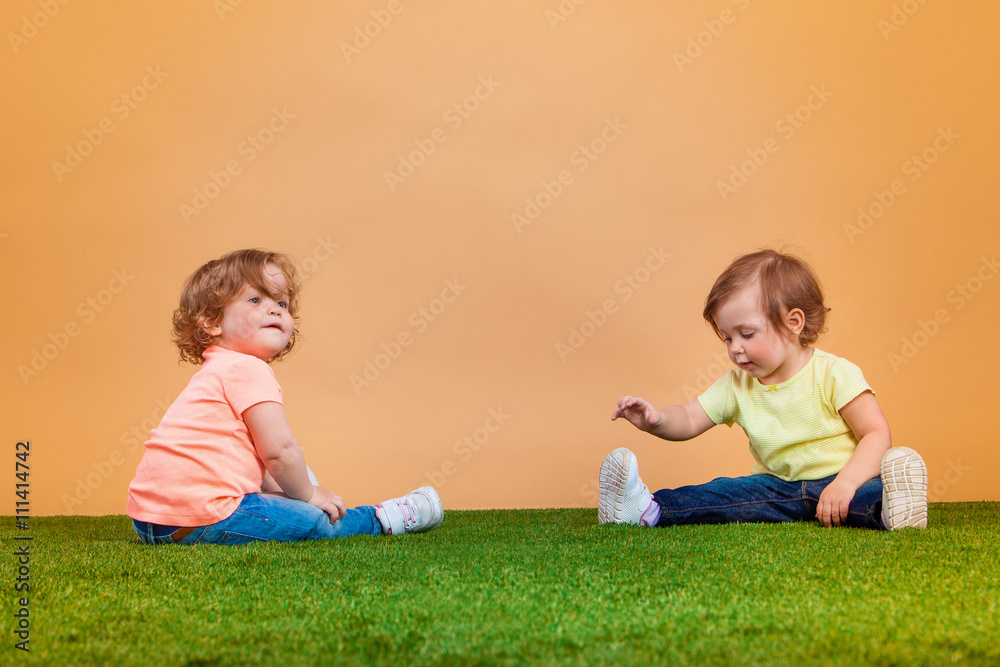 Happy funny girl twins sisters playing and laughing Happy funny girl twins sisters playing and laughing