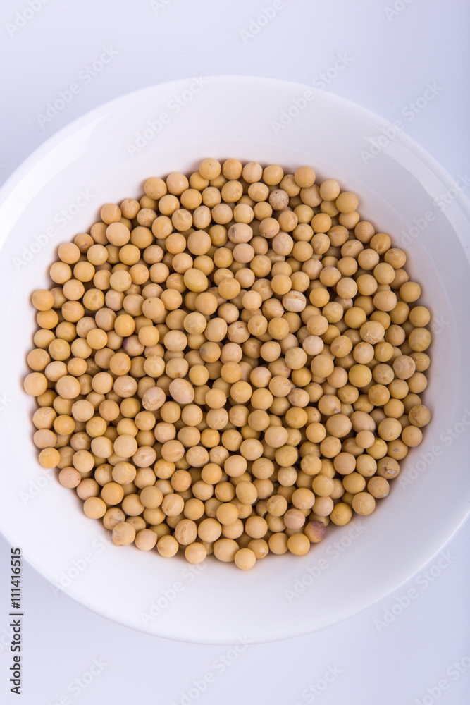 soybeans in whtie bowl on the white background soybeans in whtie bowl on the white background